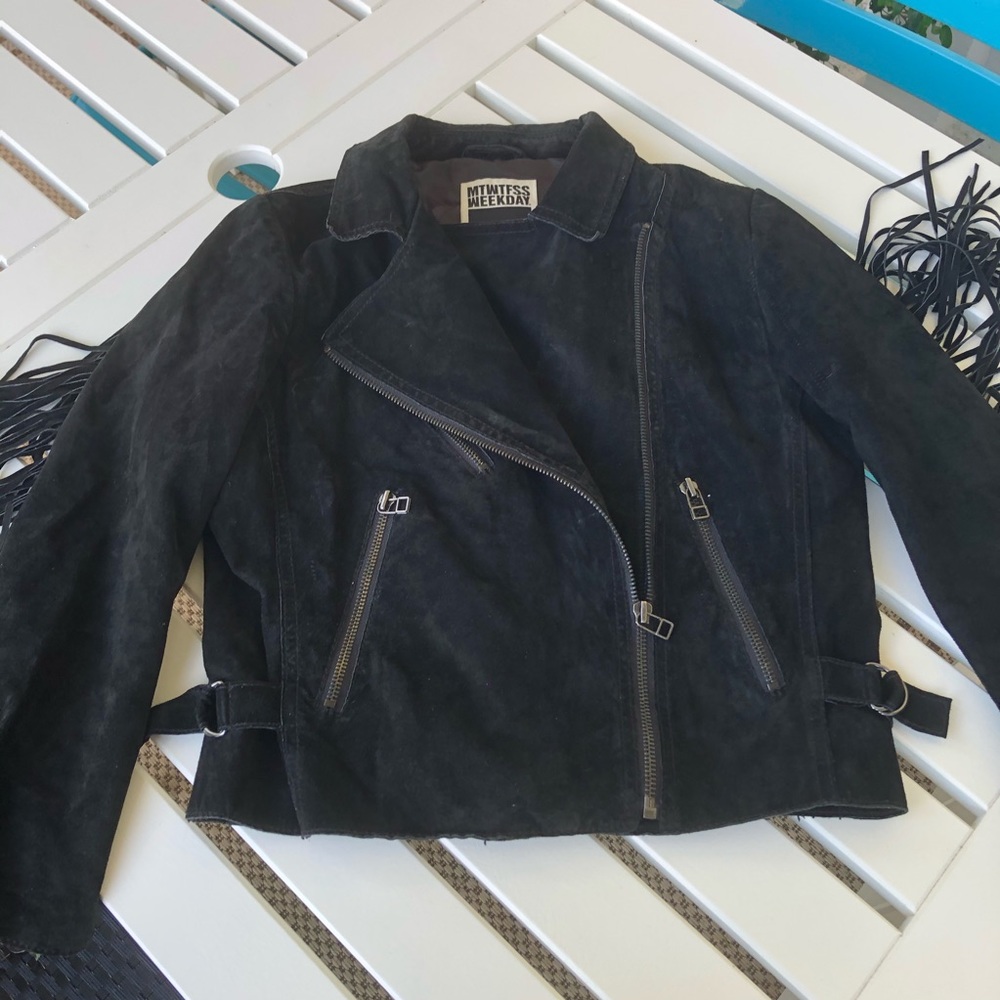 Light, suede, black fringed jacket, couture line.